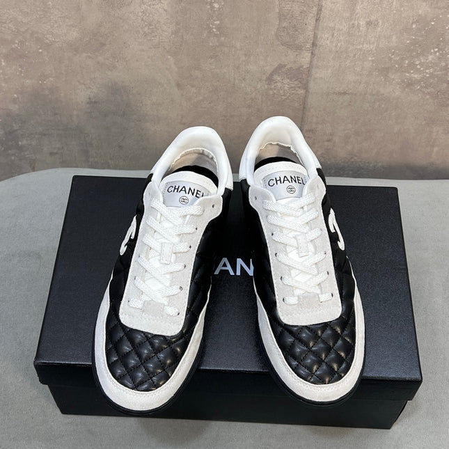CHANEL 26S SNEAKERS IN BLACK AND WHITE QUILTED CALFSKIN CC LOGO