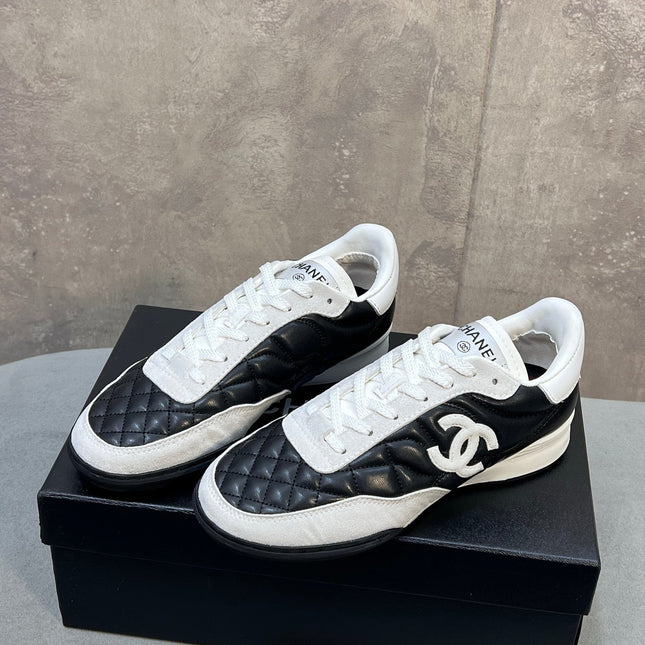 CHANEL 26S SNEAKERS IN BLACK AND WHITE QUILTED CALFSKIN CC LOGO