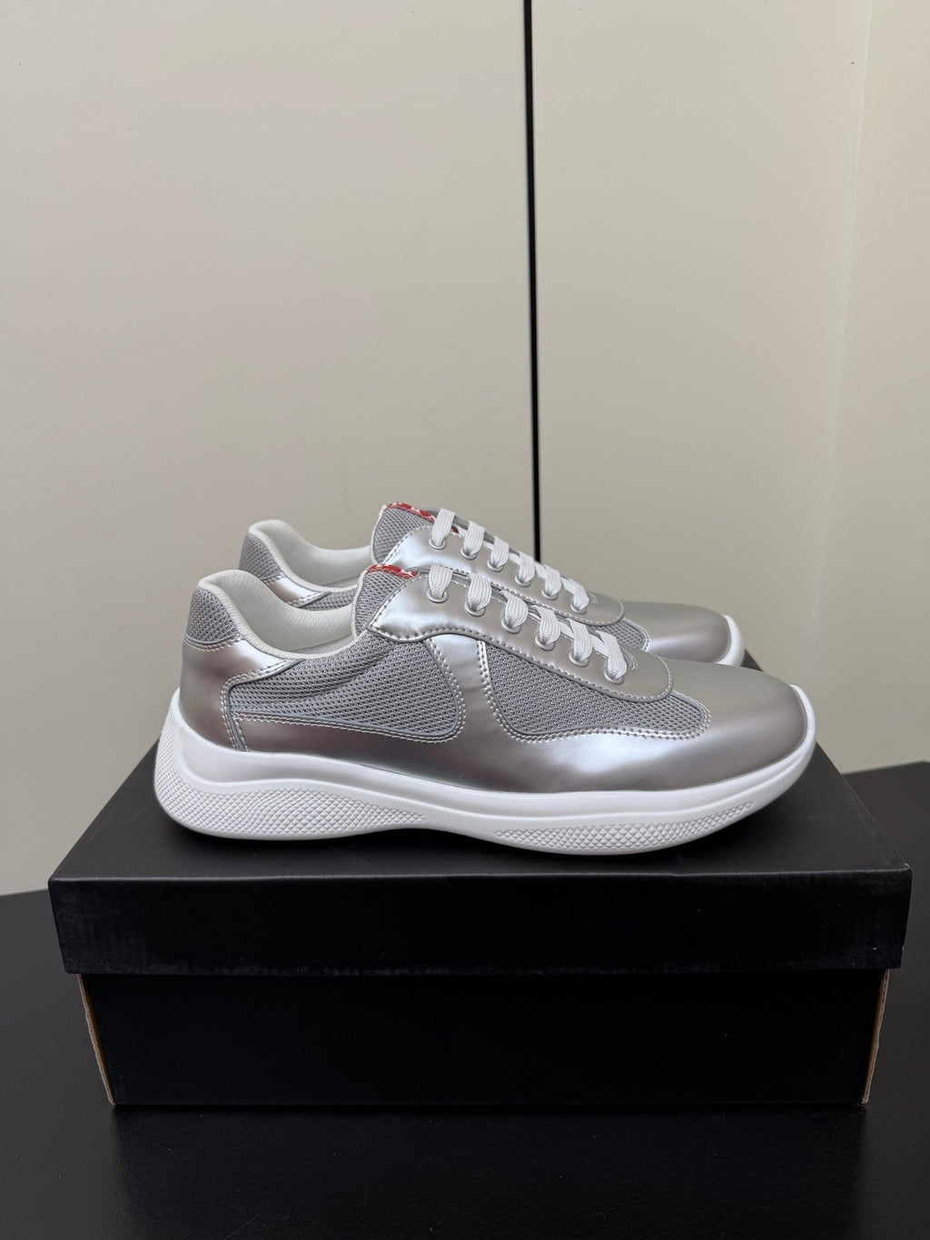 PRADA 26S SNEAKERS IN SILVER CALFSKIN AND WHITE MESH