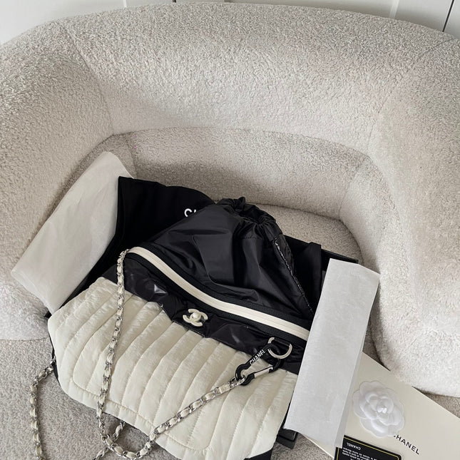 CHANEL 26S DRAWSTRING BACKPACK 44 IN BLACK AND WHITE NYLON GOLD HARDWARE