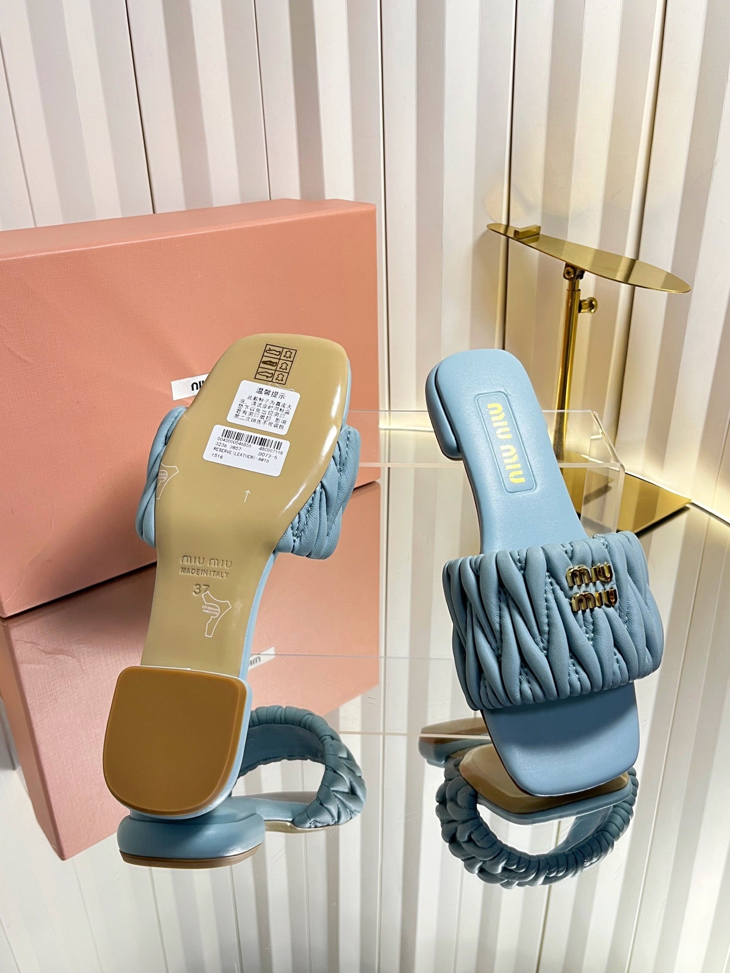 MIUMIU 26S MATELASSE SLIDES IN LIGHT BLUE CALFSKIN GOLD HARDWARE