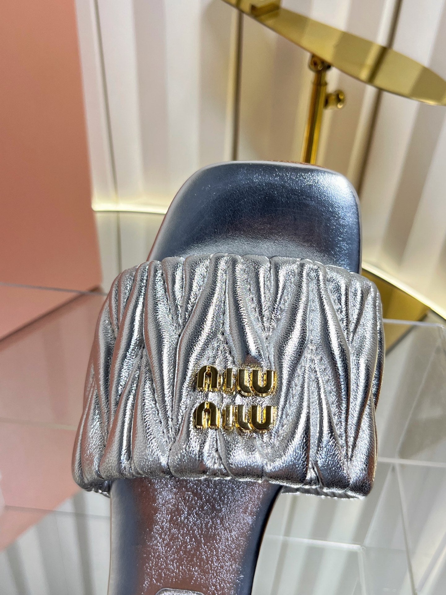 MIUMIU 26S MATELASSE SLIDES IN SILVER CALFSKIN GOLD HARDWARE