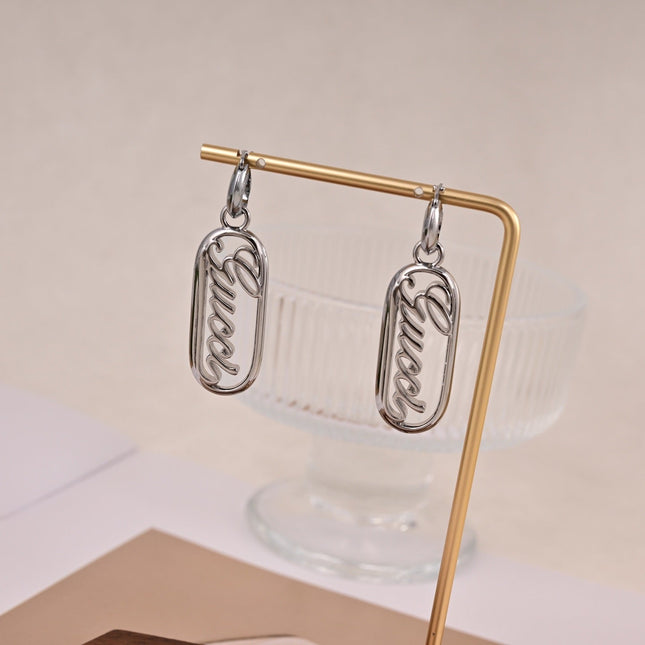 GUCCI 26S SCRIPT LOGO OVAL DROP EARRINGS IN SILVER TONE METAL 633780