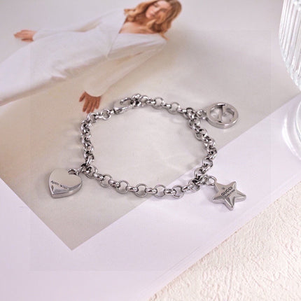 GUCCI 26S INTERLOCKING G LOGO STAR HEART MULTI CHARM CHAIN BRACELET IN SILVER TONE METAL