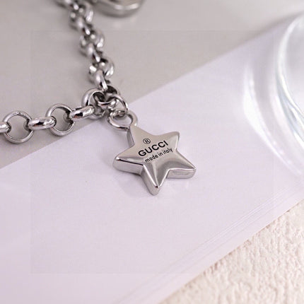 GUCCI 26S INTERLOCKING G LOGO STAR HEART MULTI CHARM CHAIN BRACELET IN SILVER TONE METAL