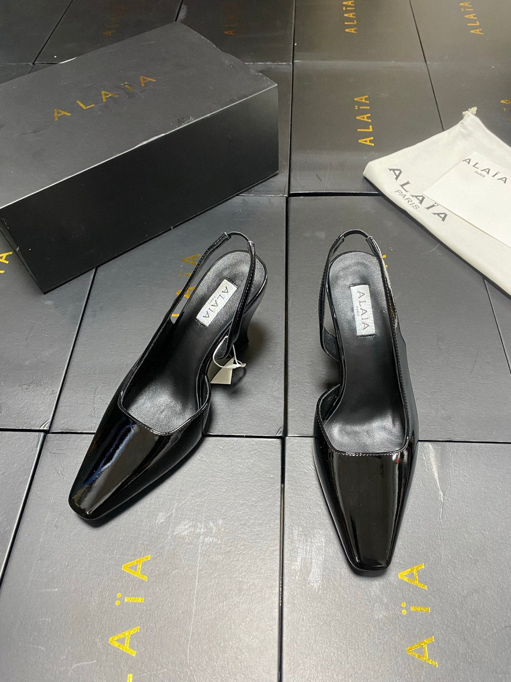 ALAIA 26S WEDGE SLINGBACKS 95 MM IN BLACK PATENT CALFSKIN