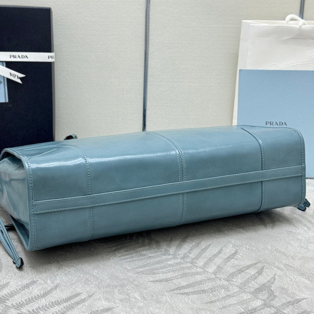 PRADA 25S LUX SOFT BAG 42 IN BLUE GLOSSY CALFSKIN GOLD HARDWARE