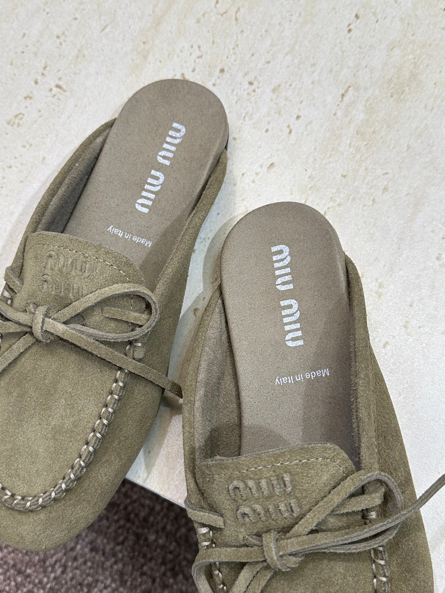 MIUMIU 26S SNEAKER MULES IN DARK OLIVE GREEN SUEDE WITH BOW