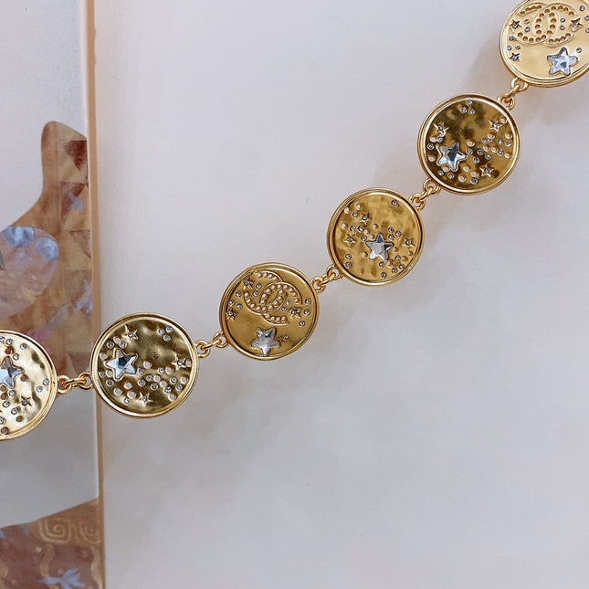TWISTED CHAIN BELT WITH RHINESTONES AND LOGO PLATE IN GOLD TONE