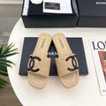 CHANEL 26S FLAT SLIDES IN BEIGE LAMBSKIN WITH BLACK CC LOGO