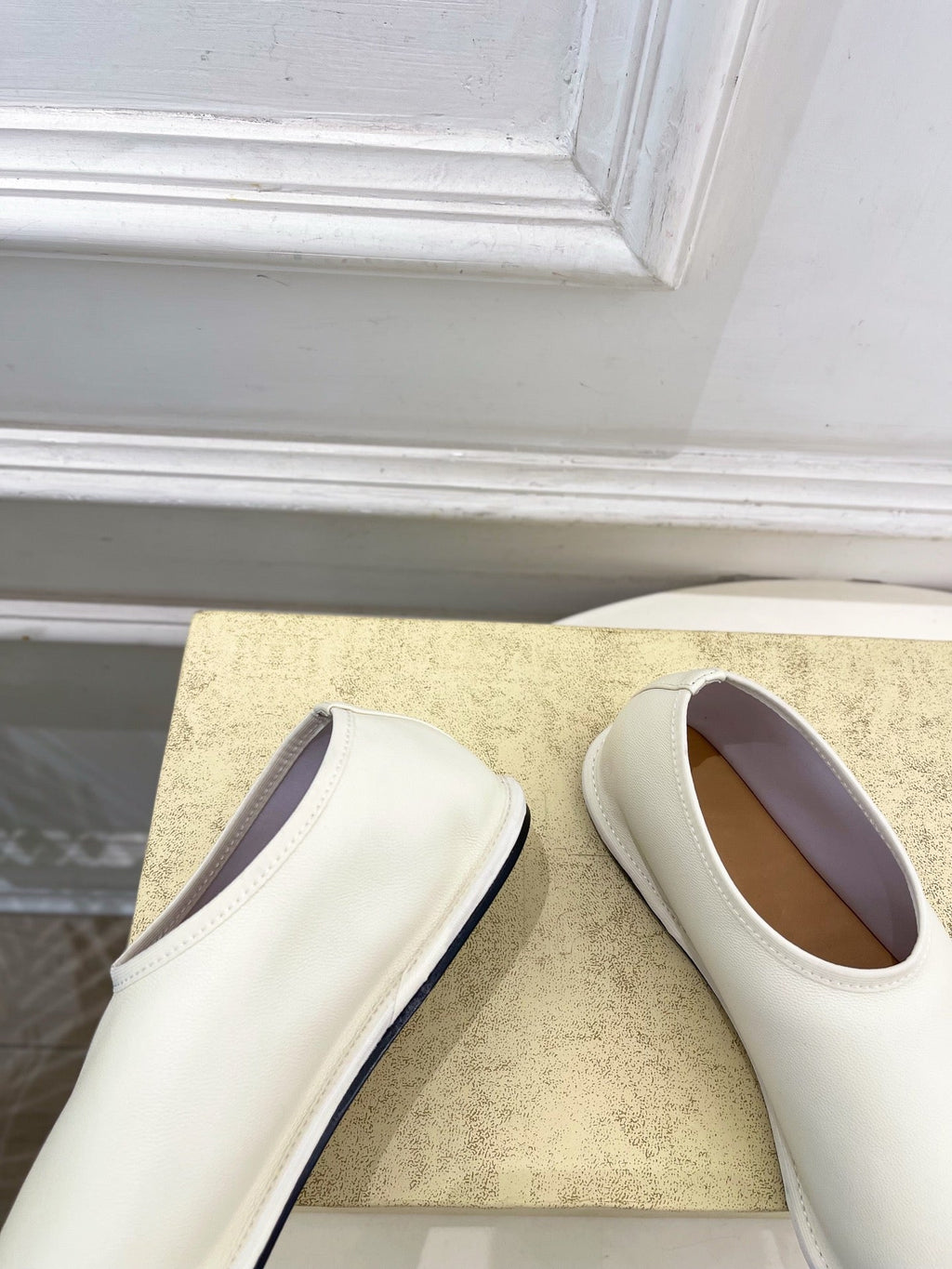 THE ROW 26S SLIP-ON FLATS IN WHITE NAPPA CALFSKIN