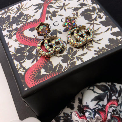 GUCCI 26S DOUBLE G LOGO MULTICOLOR CRYSTAL DROP STATEMENT EARRINGS IN AGED GOLD TONE METAL 629027