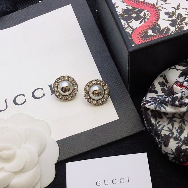 GUCCI 26S DOUBLE G LOGO PEARL CRYSTAL HALO STUD EARRINGS IN AGED GOLD TONE METAL 629031