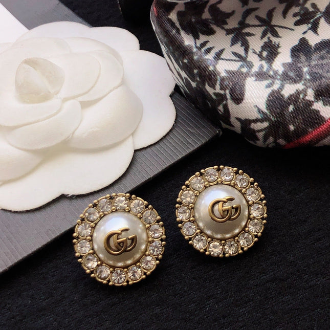 GUCCI 26S DOUBLE G LOGO PEARL CRYSTAL HALO STUD EARRINGS IN AGED GOLD TONE METAL 629031